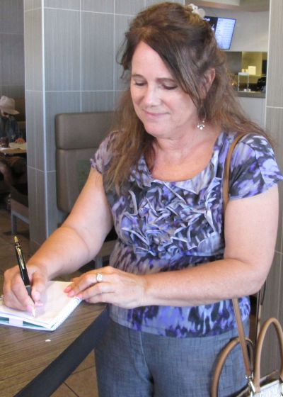 Jean DiRoss gets keys to the condo on Wednesday, July 27, 2016 at McDonalds in Tempe